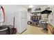 Storage room with shelving, refrigerator, and various items at 10537 W Prairie Hills Cir, Sun City, AZ 85351