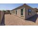 Side yard with gravel and part of the house exterior at 10550 E Sanger Ave, Mesa, AZ 85212