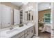 Double sink bathroom with view into bedroom at 10550 E Sanger Ave, Mesa, AZ 85212