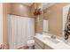 Clean bathroom with a shower/tub combo and vanity at 10550 E Sanger Ave, Mesa, AZ 85212