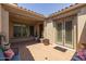 Inviting courtyard entry with sitting area, fountain, and double doors at 10550 E Sanger Ave, Mesa, AZ 85212