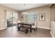 Bright dining room with table and bench seating at 10550 E Sanger Ave, Mesa, AZ 85212