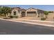 Home exterior with a two car garage and landscaping at 10550 E Sanger Ave, Mesa, AZ 85212