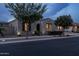 Night view of house exterior, landscaping, and street at 10550 E Sanger Ave, Mesa, AZ 85212