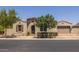 Charming single-story home featuring a tile roof, arched doorway, and a well-manicured front yard at 10550 E Sanger Ave, Mesa, AZ 85212