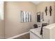 Home office with built-in desk and large artwork at 10550 E Sanger Ave, Mesa, AZ 85212