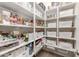 Well-organized pantry with ample shelving for storage at 10550 E Sanger Ave, Mesa, AZ 85212