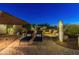 Relaxing backyard patio with lounge chairs and a water feature at 10888 N 136Th Pl, Scottsdale, AZ 85259