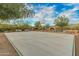 Community basketball court with painted lines and surrounding trees at 10888 N 136Th Pl, Scottsdale, AZ 85259