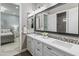 Double vanity bathroom with a view into a bedroom at 10888 N 136Th Pl, Scottsdale, AZ 85259