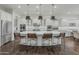 Gourmet kitchen with white cabinetry, large island, and high-end appliances at 10888 N 136Th Pl, Scottsdale, AZ 85259