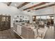 Open concept living room with kitchen views, high ceilings, and lots of natural light at 10888 N 136Th Pl, Scottsdale, AZ 85259