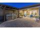 Outdoor kitchen and patio with seating area under pergola at 10888 N 136Th Pl, Scottsdale, AZ 85259