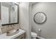 Modern powder room with a stylish vessel sink and mosaic tile at 10888 N 136Th Pl, Scottsdale, AZ 85259