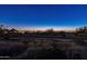 Evening view of city lights and mountains at 10888 N 136Th Pl, Scottsdale, AZ 85259