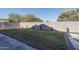 Small backyard with grass, patio, and block wall at 11246 W Chase Dr, Avondale, AZ 85323