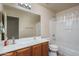 Bathroom with double vanity and shower/tub combo at 11246 W Chase Dr, Avondale, AZ 85323