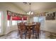 Bright dining room with a wooden table and six chairs at 11246 W Chase Dr, Avondale, AZ 85323