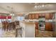 Kitchen with island, stainless steel appliances, and breakfast bar at 11246 W Chase Dr, Avondale, AZ 85323