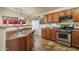 Kitchen with stainless steel appliances and wood cabinets at 11246 W Chase Dr, Avondale, AZ 85323