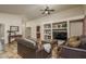 Bright living room with leather couches and a large TV at 11246 W Chase Dr, Avondale, AZ 85323