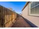 Long narrow backyard with wooden fence at 11275 N 99Th Ave # 188, Peoria, AZ 85345