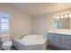 Bathroom features a large garden tub and vanity at 11275 N 99Th Ave # 188, Peoria, AZ 85345