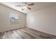 Simple bedroom with wood-look floors and window blinds at 11275 N 99Th Ave # 188, Peoria, AZ 85345