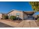 Single-wide manufactured home with carport and landscaping at 11275 N 99Th Ave # 188, Peoria, AZ 85345