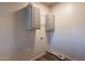 Laundry room with upper cabinets and vinyl flooring at 11275 N 99Th Ave # 188, Peoria, AZ 85345