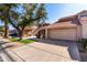 Tan two-story home with tile roof and attached garage at 11515 N 91St St # 248, Scottsdale, AZ 85260