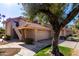 Tan two-story home with tile roof and attached garage at 11515 N 91St St # 248, Scottsdale, AZ 85260