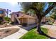 Tan two-story home with tile roof and attached garage at 11515 N 91St St # 248, Scottsdale, AZ 85260