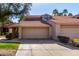 Tan two-story home with tile roof and attached garage at 11515 N 91St St # 248, Scottsdale, AZ 85260