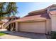 Tan two-story home with tile roof and attached garage at 11515 N 91St St # 248, Scottsdale, AZ 85260