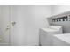 Laundry room with washer, dryer, and additional shelving at 11515 N 91St St # 248, Scottsdale, AZ 85260