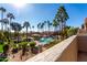 Community pool and surrounding landscape viewed from a balcony at 11515 N 91St St # 248, Scottsdale, AZ 85260