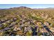 Aerial perspective of a luxury home community near a golf course and mountains at 1211 W Sousa Ct, Anthem, AZ 85086