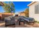 Outdoor patio features a built-in fire place and comfortable seating at 1211 W Sousa Ct, Anthem, AZ 85086