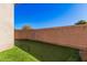 Landscaped backyard with putting green at 1211 W Sousa Ct, Anthem, AZ 85086