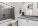 Modern bathroom with a walk-in shower and grey countertop at 1211 W Sousa Ct, Anthem, AZ 85086