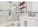 Spa-like bathroom with marble shower, floating shelves, and modern vanity at 1211 W Sousa Ct, Anthem, AZ 85086