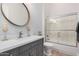 Modern bathroom with gray vanity, quartz countertop, and walk-in shower at 1211 W Sousa Ct, Anthem, AZ 85086