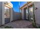 Private courtyard with brick pavers and tall cacti at 1211 W Sousa Ct, Anthem, AZ 85086