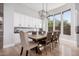 Spacious dining area with a long wooden table and upholstered chairs at 1211 W Sousa Ct, Anthem, AZ 85086