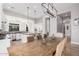 Bright dining room with a large wooden table and six chairs at 1211 W Sousa Ct, Anthem, AZ 85086