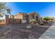 Home's exterior showcases desert landscaping and a neutral color palette at 1211 W Sousa Ct, Anthem, AZ 85086