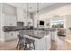 Gourmet kitchen boasts granite island and white cabinetry at 1211 W Sousa Ct, Anthem, AZ 85086