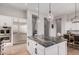 Kitchen island with granite countertop and seating for two at 1211 W Sousa Ct, Anthem, AZ 85086