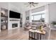 Living room with a modern fireplace and built-in shelving at 1211 W Sousa Ct, Anthem, AZ 85086